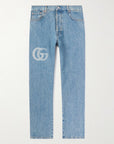 GUCCI
Tapered Logo-Print Jeans