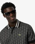 Polo dal taglio classico in jacquard con monogramma